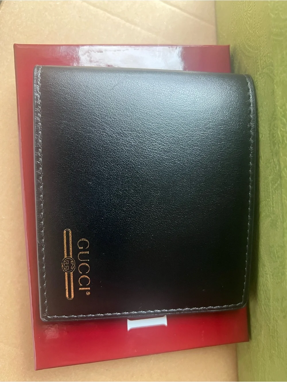 Gucci Black Leather Bifold Wallet with Gold Logo Accent